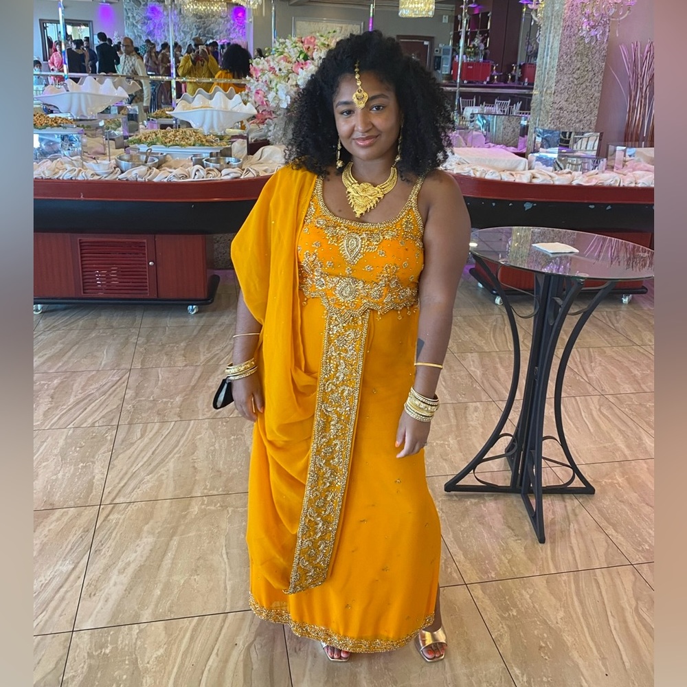 Elegant Orange Saree with Gold Embellishments
